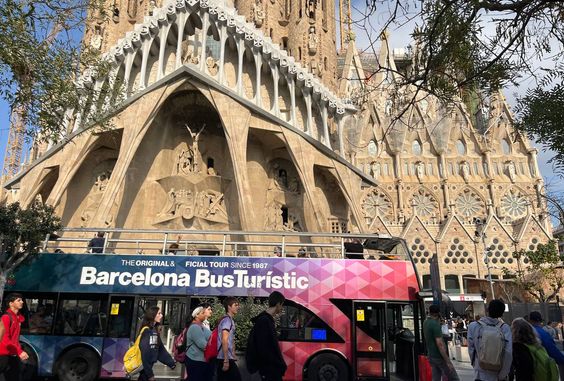 Sagrada in the background of a bus