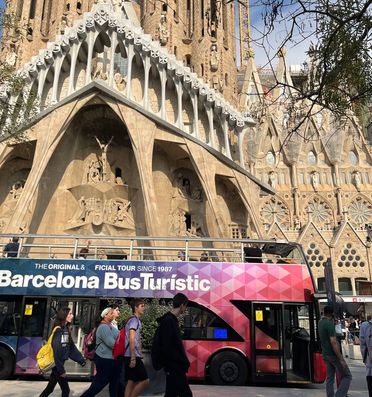 Sagrada in the background of a bus