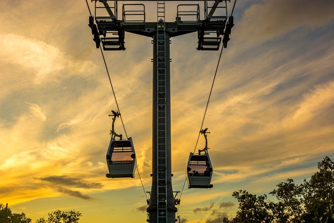 Cable car with golden sunset sky in Barcelona