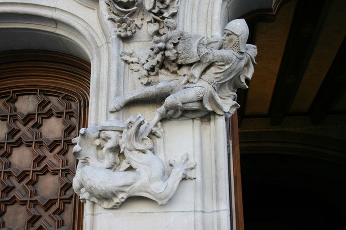 Close-up of a knight battling a mythical creature on Casa Amatller's façade