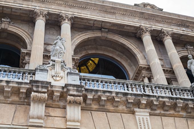 Detailed view of the MNAC building façade with columns and statues