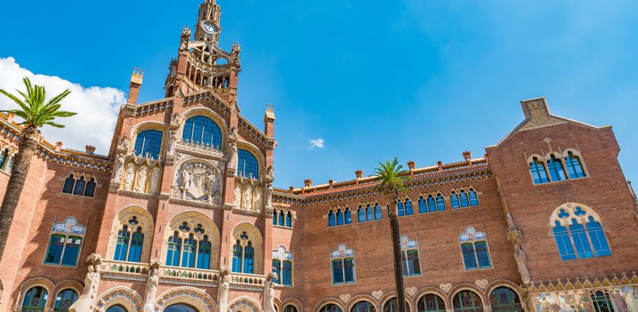 The ornate facade of the Hospital de Sant Pau in Barcelona, a renowned hall with architectural details.