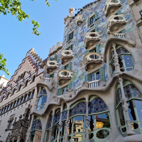 Architectural detail of Casa Batlló with organic shapes and vibrant colors