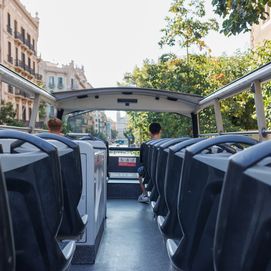 Open-top city bus in Barcelona offering scenic views of the city streets