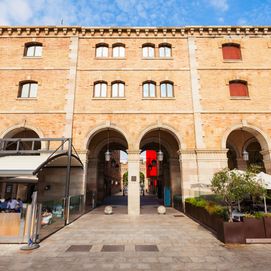 History Museum of Catalonia with arched brick facade and outdoor terrace