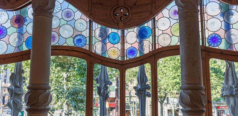 Interior view of the stained glass dome in Casa Batllo, a famous architectural landmark.